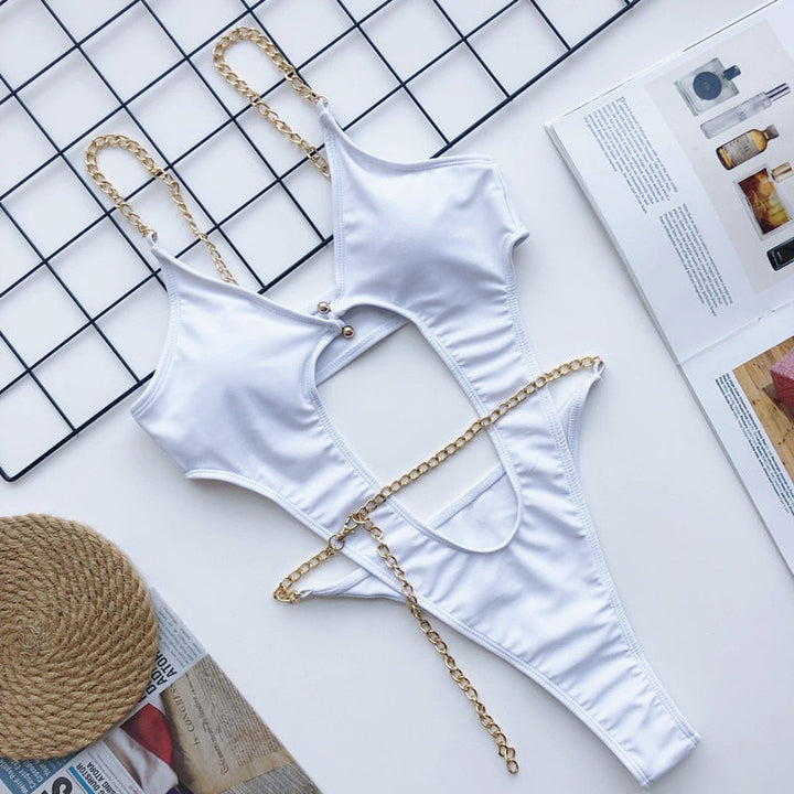 Costume da bagno intero con catene decorative e cut-out