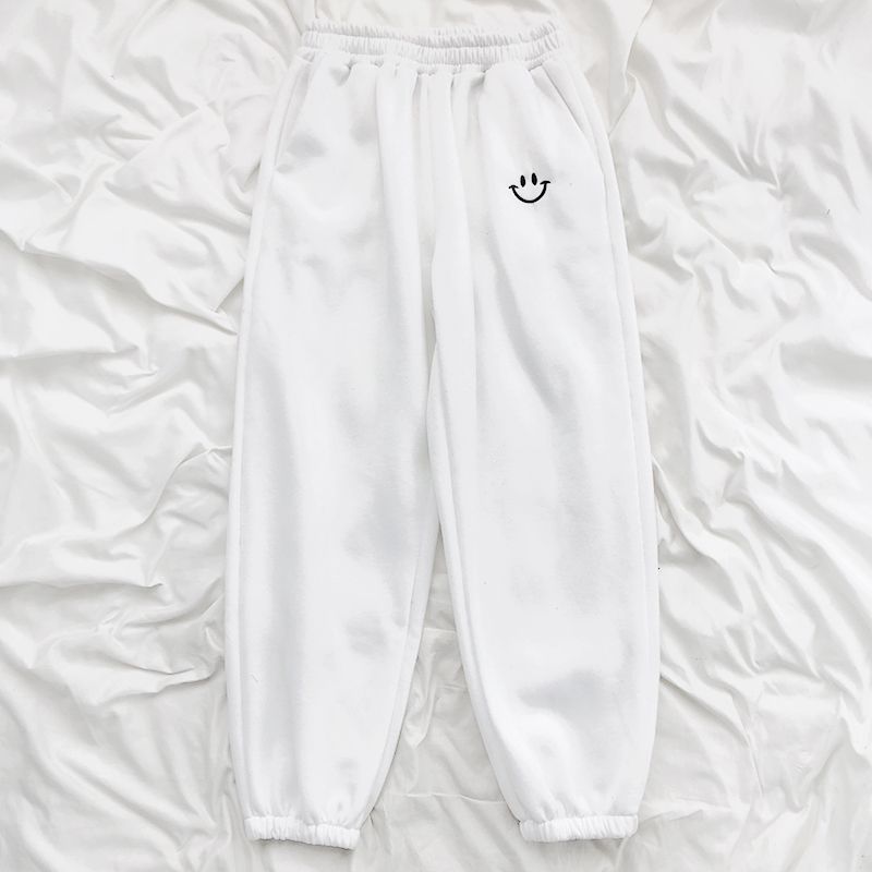 Pantaloni tuta comodi con faccina ricamata
