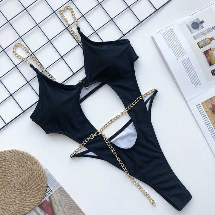 Costume da bagno intero con catene decorative e cut-out