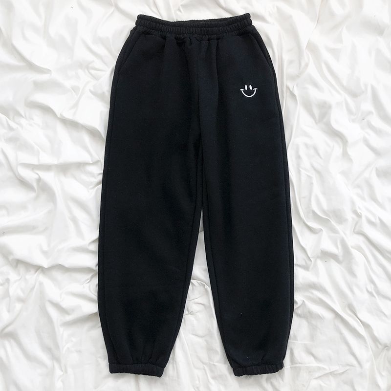 Pantaloni tuta comodi con faccina ricamata